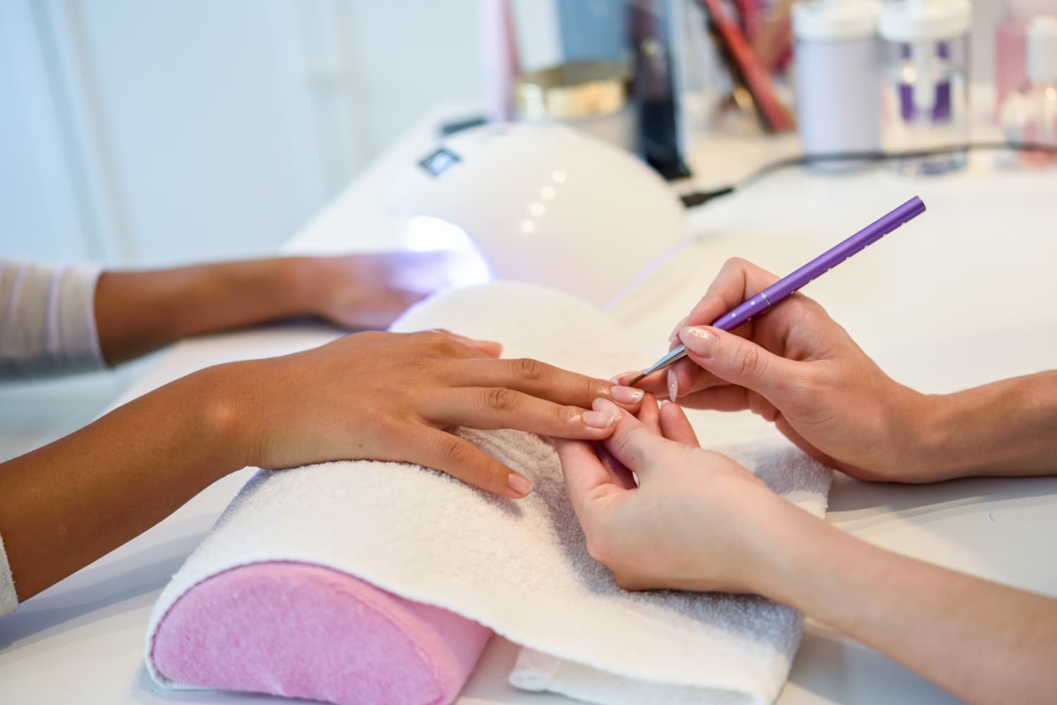 Close-up of a manicure treatment in progress
